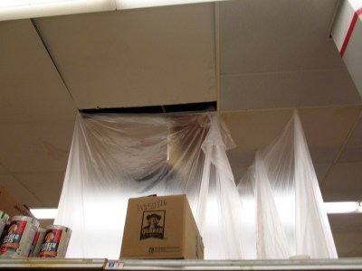 Plastic barrier to contain leaking fluids inside the Safeway store.